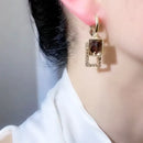 Brincos Feminino -  Zircão geométrico Banhado a Ouro